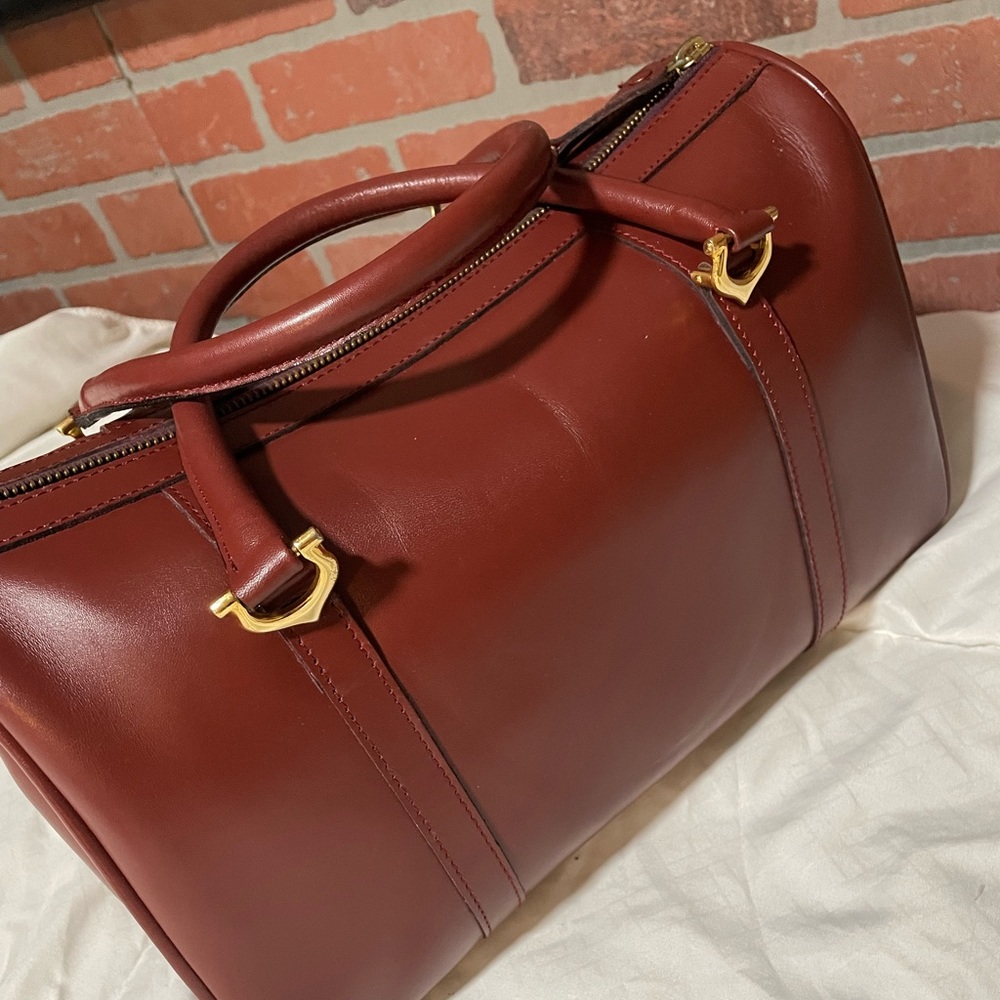 Cartiers hand bag with lock (misplaced the key) preloved in great condition